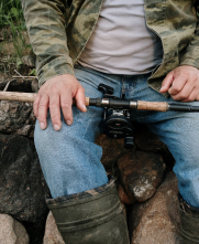 man sitting fishing