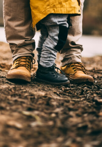 dad and son feet wearing boots