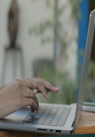 person typing on laptop