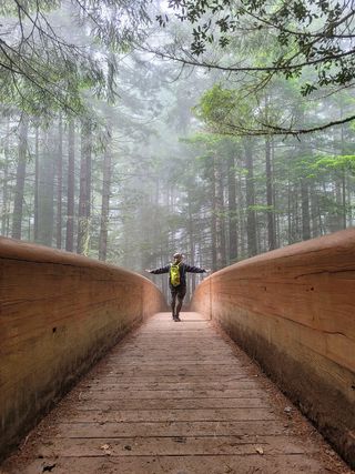 person on big wooden bridge